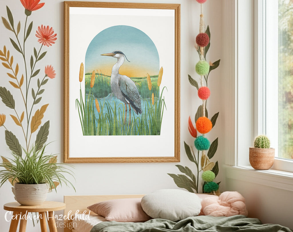 Framed artwork of a heron in a lake setting on a wall with a floral wall mural, pompom decorations, plants and pillows.
