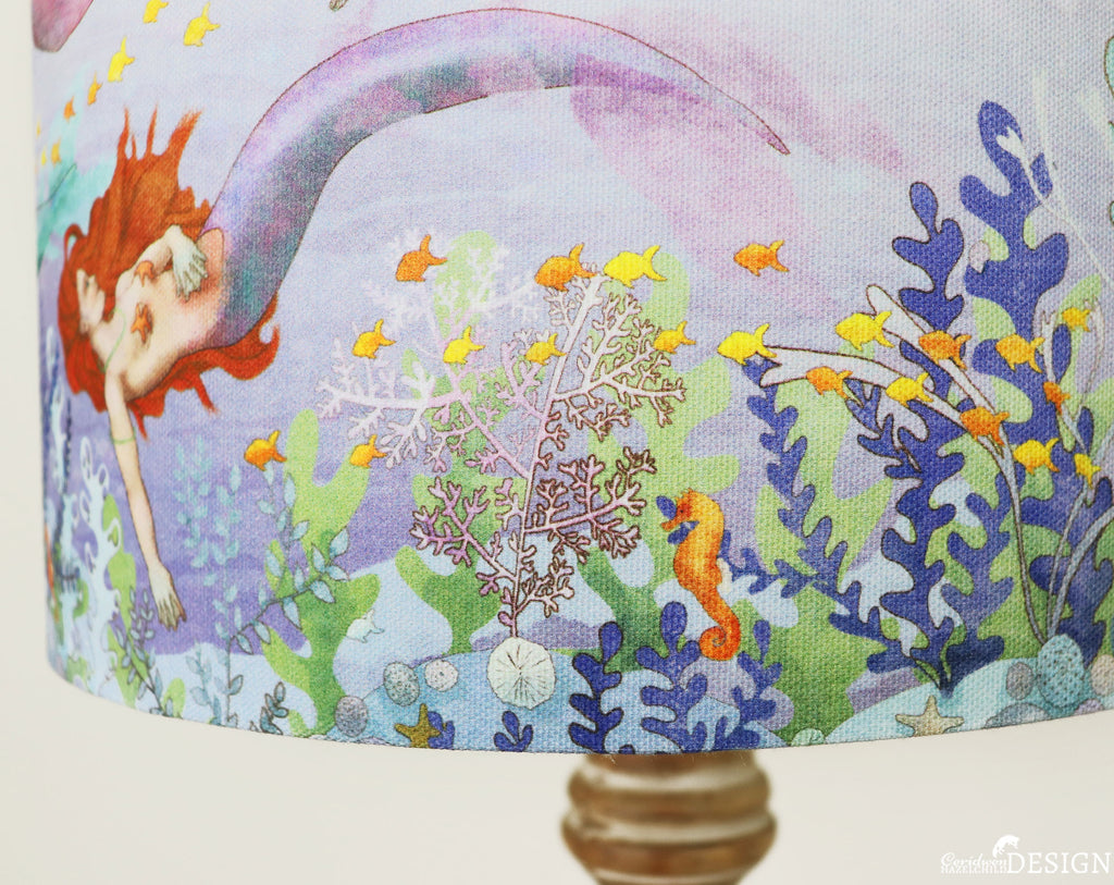 Detail of A Mermaid Lampshade illustrared by Ceridwen Hazelchild, showing a seahorse amongst seaweed.