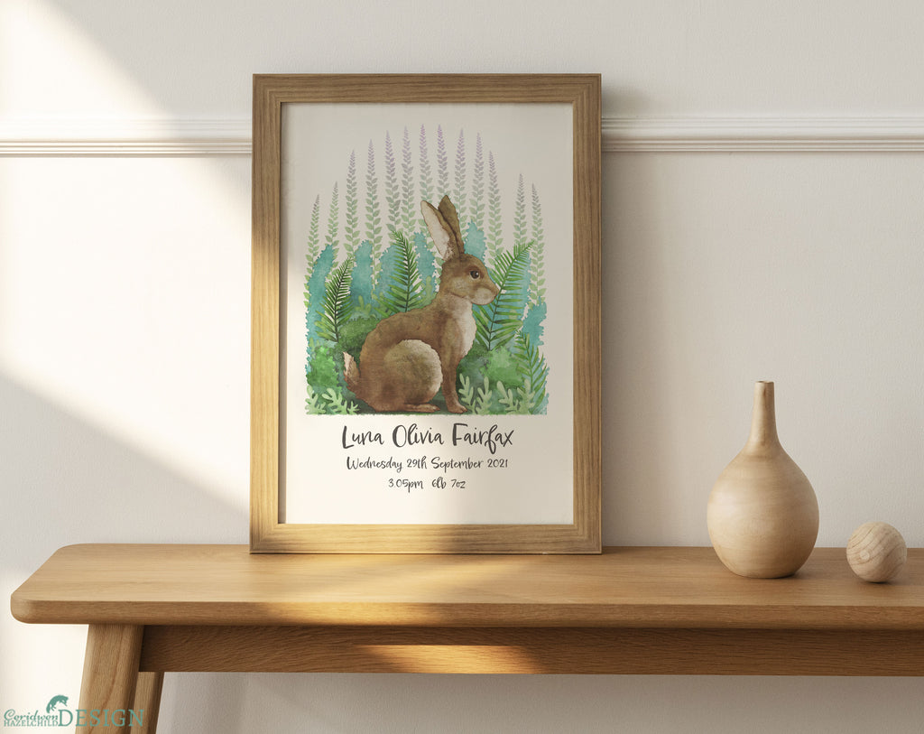 An A4 art print featuring a rabbit sitting amongth green leaves, and customised with a baby girl's name and birthday.